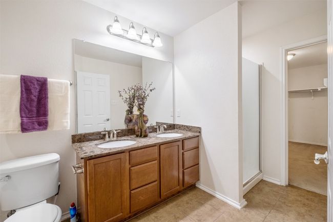 Primary Full bath featuring double vanity, garden tub & separate shower, walk in closet | Image 23