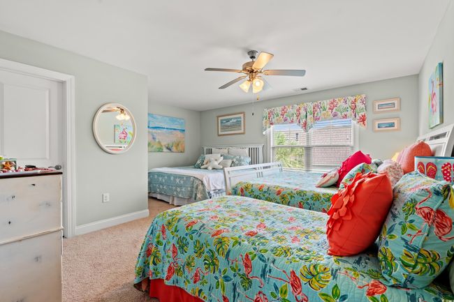 Bedroom with carpet floors and ceiling fan | Image 24