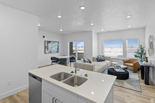 Kitchen with recessed lighting, open floor plan, dishwasher, and a sink | Image 8