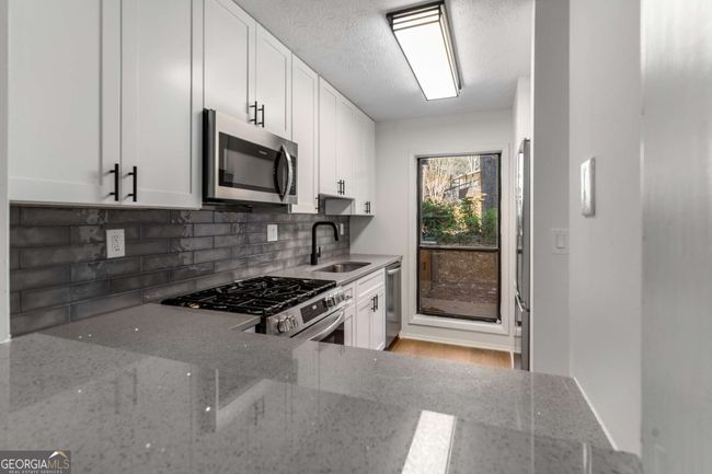 1003 Cumberland Ct Se, Condo with 2 bedrooms, 1 bathrooms and 2 parking in Smyrna GA | Image 11