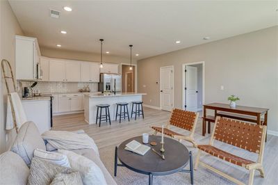 Living room with light hardwood / wood-style floors | Image 3