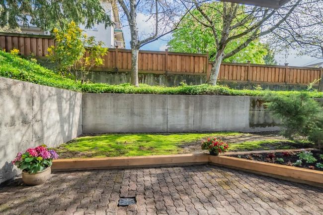 View of fenced backyard | Image 15