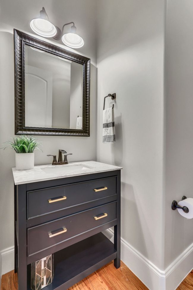 Handsome sink offers storage in the guest bath. | Image 37