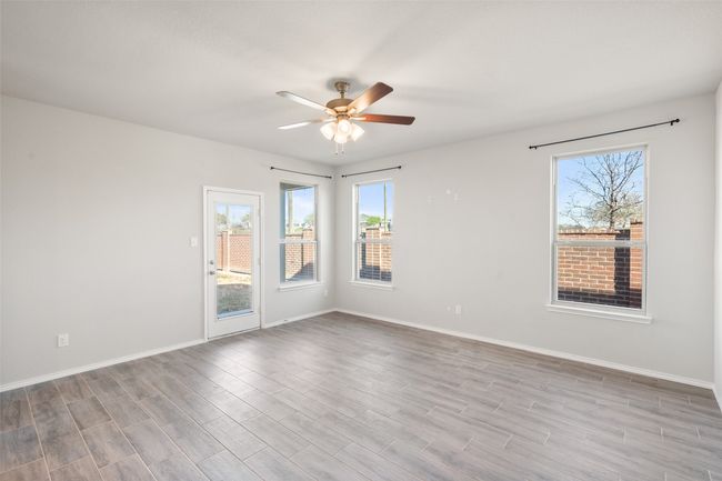 Living Room with an exit to the patio and back yard | Image 4