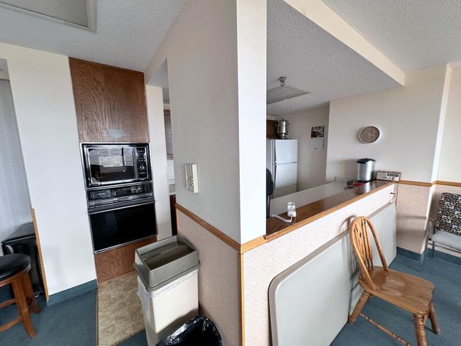 Kitchen area in the game room | Image 29