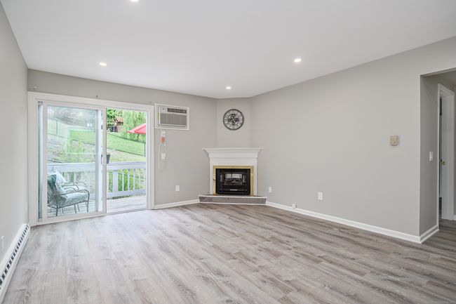 Livingroom with Sliders to private deck. | Image 5