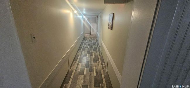 Corridor with dark wood-style floors | Image 35