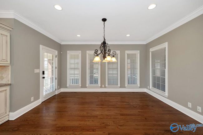 Wood flooring, lots of natural light, recessed lighting, crown molding | Image 9