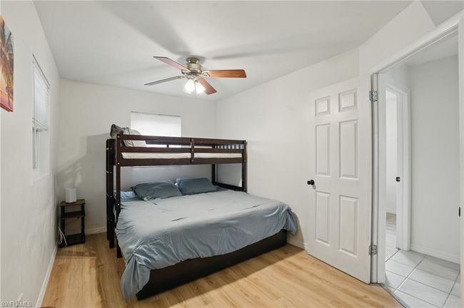 Bedroom featuring wood finished floors and a ceiling fan | Image 28