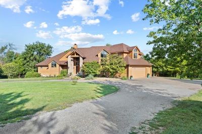 Paved Circle drive with side entry 3 car garage | Image 3