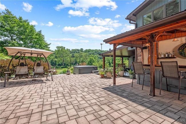 Outdoor patio for entertaining with hot tub | Image 41