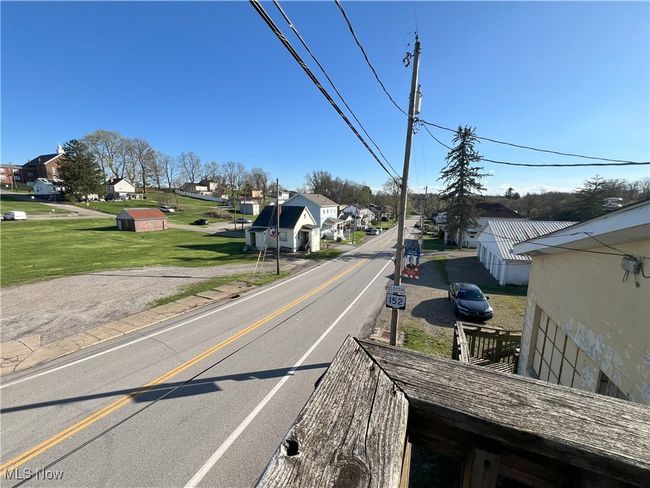 View of road with a residential view from apartment | Image 35