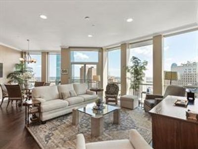 Living area with floor to ceiling windows and a view of Sundance Square! | Image 1