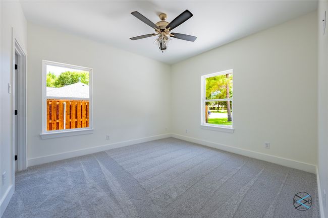 Carpeted spare room with ceiling fan | Image 21