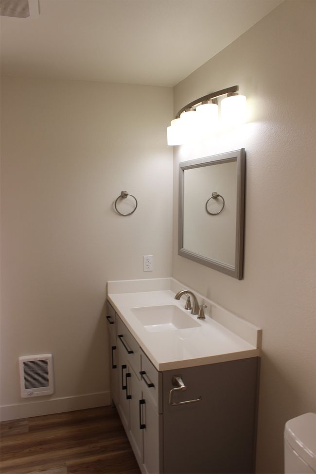 Half bath featuring vanity and wood finished floors | Image 16