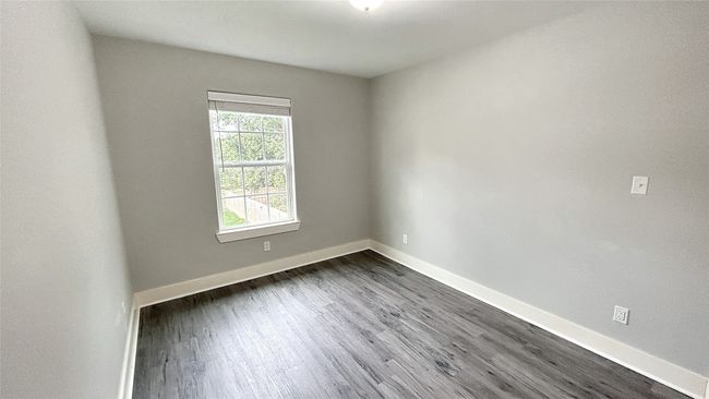 Spare room with dark wood-style flooring | Image 7