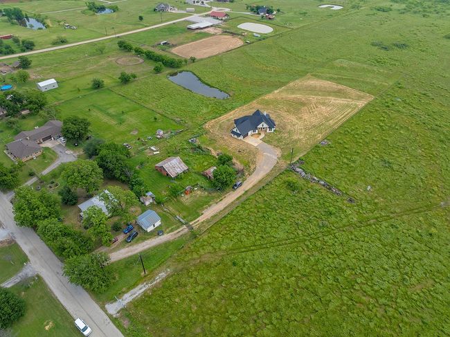 Aerial view of property's location with a nearby body of water | Image 35