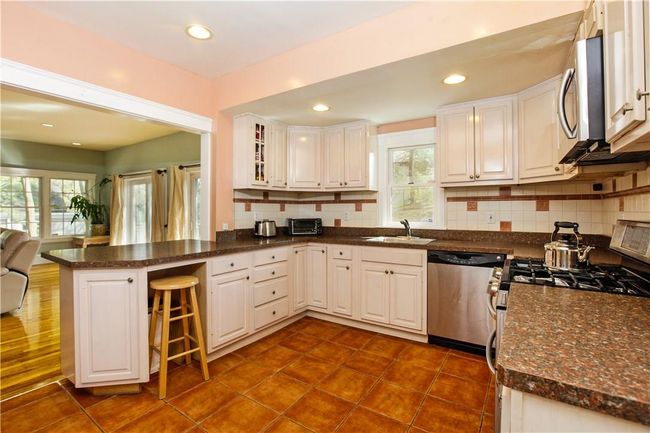 Another view of the kitchen open to the family room. | Image 4