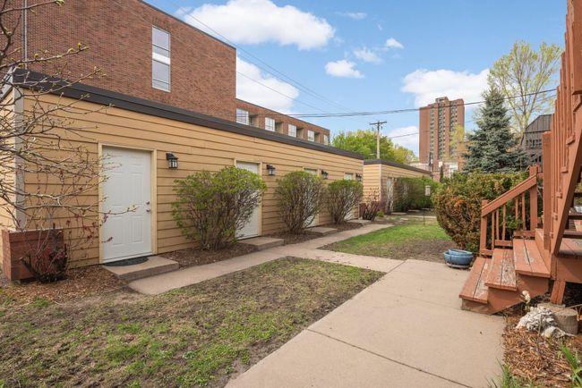 The third service door from the left of this photo is the access to the private garage. | Image 26