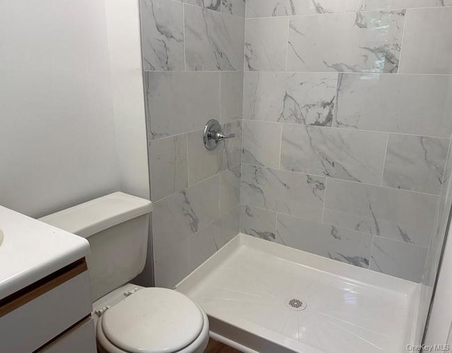 Bathroom with new vanity and tiled shower | Image 13