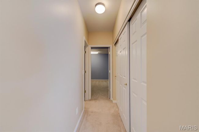This hallway connects you to the large, three-door closet, the bathroom, and the Bonus Room. | Image 33