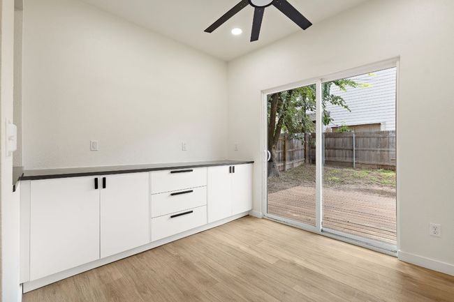 Spare room with ceiling fan, light wood-style flooring, and recessed lighting | Image 12