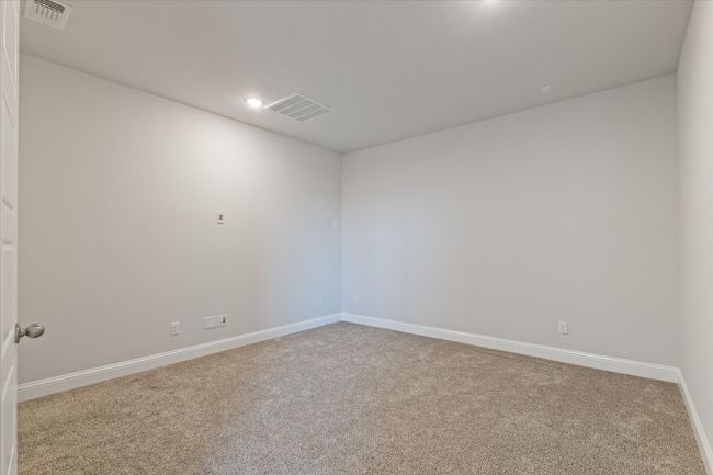 Spare room featuring carpet flooring, baseboards, and recessed lighting | Image 29