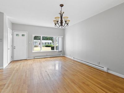 Conversion living room with fireplace, could be dining area or media room | Image 3