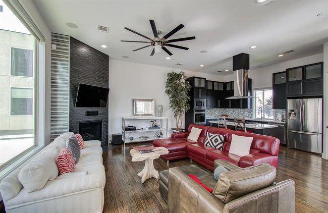 2nd floor living space with high ceilings, custom blinds and tons of natural light! | Image 6