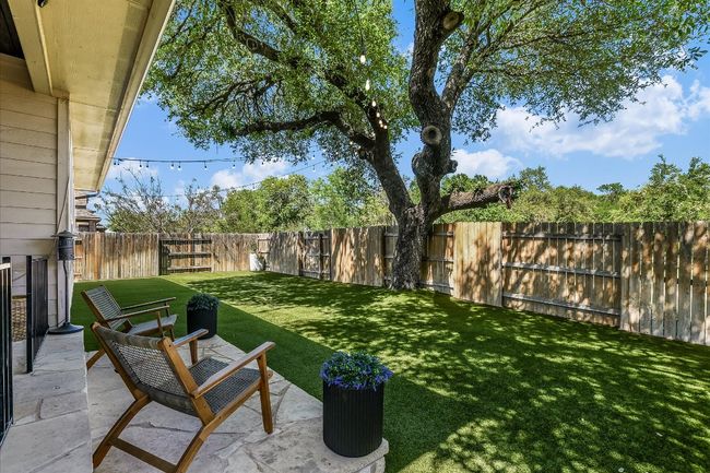 View of yard featuring a patio area and a fenced backyard | Image 28