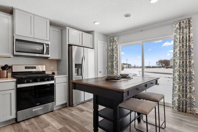 Lots of cabinets and pantry space will ensure that you have plenty of storage options. Photo is of model home. Colors and options may vary. Ask Sales Agent for details. | Image 8