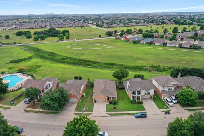 Aerial perspective of suburban area featuring a pool area | Image 38