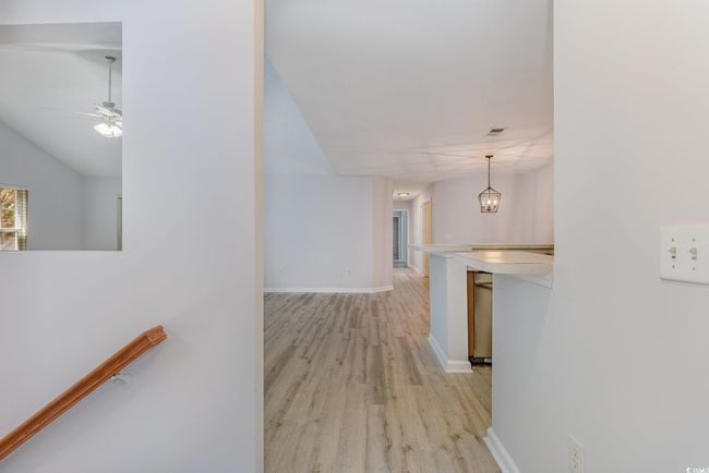Interior space featuring light wood-style floors, baseboards, visible vents, and washer / dryer | Image 26