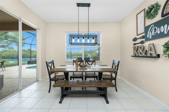 Beautiful Pool and Lake Views from Dining Room table! | Image 26