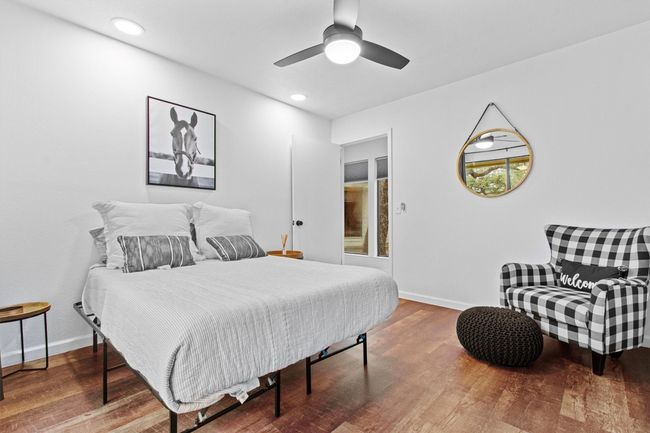 Bedroom with ceiling fan and wood-type flooring | Image 22