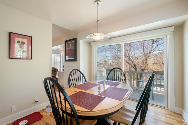 Dining space with light wood finished floors and baseboards | Image 23