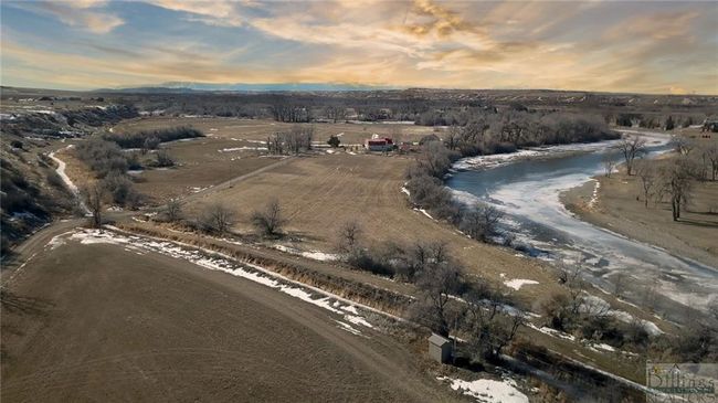 The back field along with the portions following the road are part of this parcel. (Residence is not part of this property). | Image 13