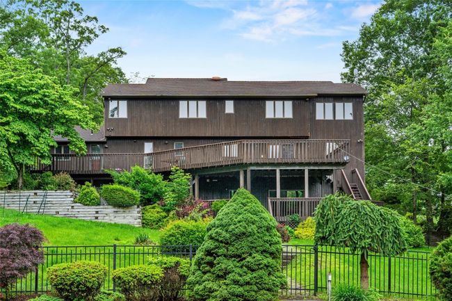 Back of property featuring a wooden deck and stairway | Image 39