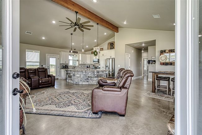 Living area with ceiling fan & beam ceiling | Image 6