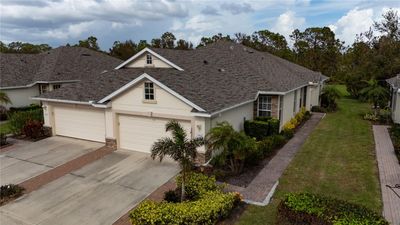 Front of villa with sidewalk to front door | Image 1