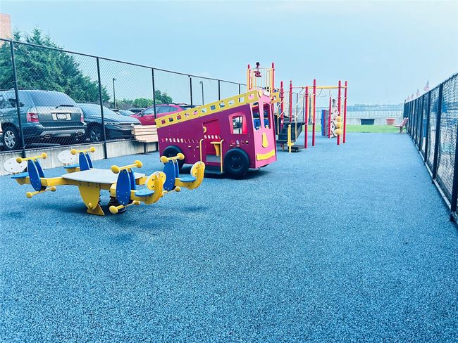 Community play area featuring fence | Image 12