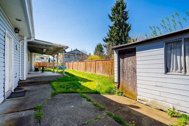 View of yard featuring fence and a patio | Image 26