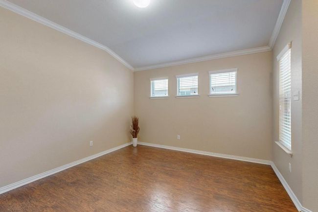 This is the room staged as a formal dining space at the front. I have seen this used for home school room, 2 living room and a dining room. This floor plan has flexibility. | Image 18