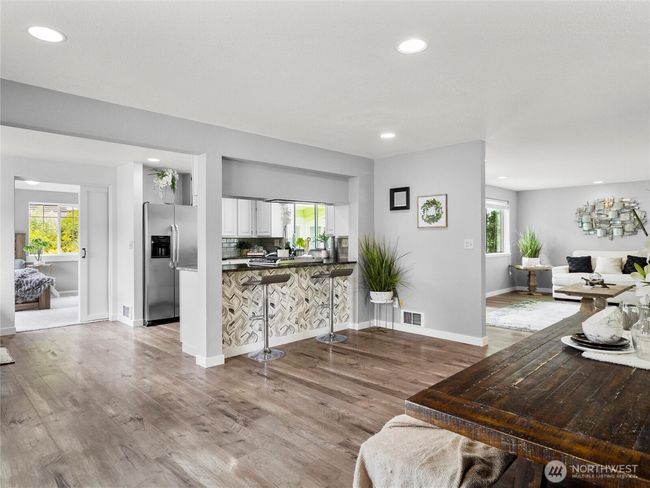 Views of the kitchen into open concept living | Image 11