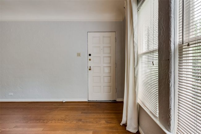 Entryway featuring wood finished floors and crown molding | Image 6