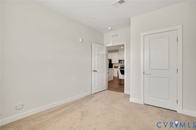 2nd bedroom with spacious carpet. | Image 20