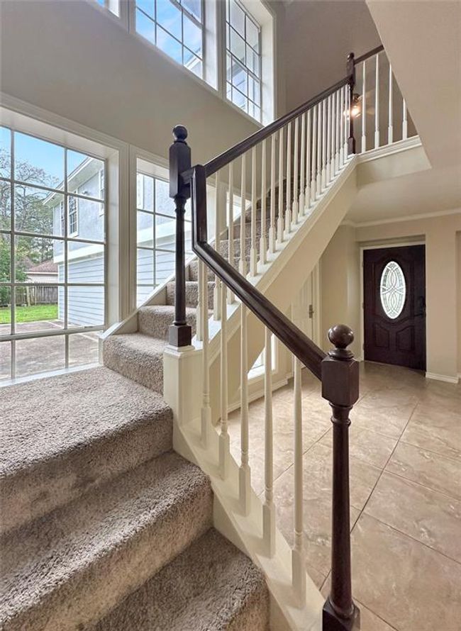 With two staircases providing easy access between floors and an open-concept design that connects the balcony, game room, and living spaces, this home offers comfort and convenience for every generation | Image 8