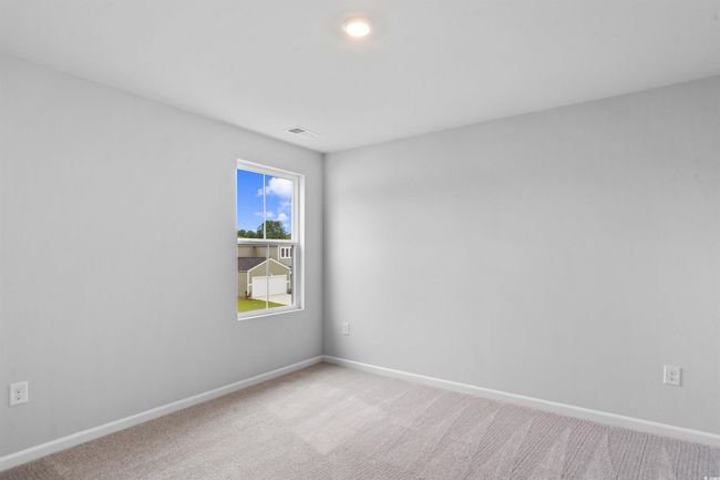 Empty room featuring baseboards, visible vents, carpet flooring, and recessed lighting | Image 11