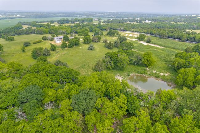 Aerial overview of property's location with a large body of water | Image 38