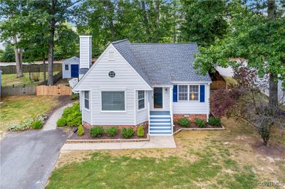 View of front of home featuring a front lawn and a shed | Image 1